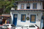 O Sorriso do Lagarto Ouro Preto - Image 1